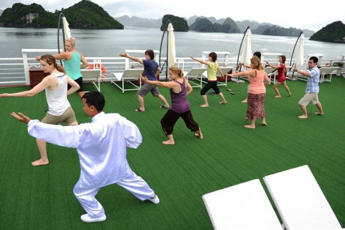 Practice Taichi on boat in Halong bay 